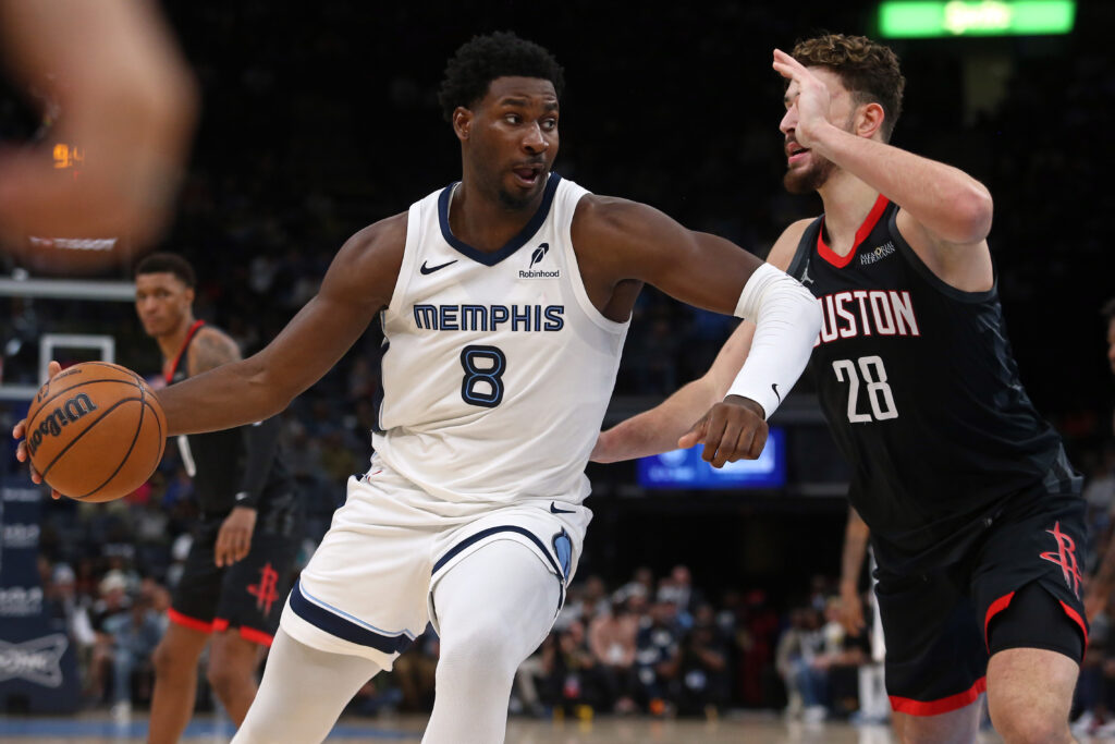 Nov 5, 2025; Memphis, Tennessee, USA; Memphis Grizzlies forward/center Jaren Jackson Jr. (8) drives to the basket as Houston Rockets center Alperen Sengun (28) defends during the second quarter at FedExForum. Mandatory Credit: Petre Thomas-Imagn Images