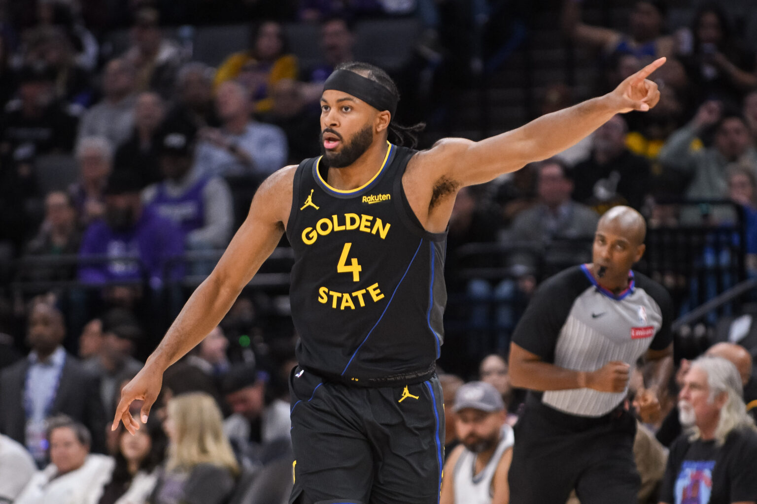 Nov 5, 2025; Sacramento, California, USA; Golden State Warriors guard Moses Moody (4) reacts after scoring against the Sacramento Kings during the second quarter at Golden 1 Center. Mandatory Credit: Ed Szczepanski-Imagn Images