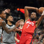 Nov 7, 2025; San Antonio, Texas, USA; Houston Rockets forward Kevin Durant (7) passes against San Antonio Spurs guard Stephon Castle (5) and guard Devin Vassell (24) during the second quarter at Frost Bank Center. Mandatory Credit: Dustin Safranek-Imagn Images