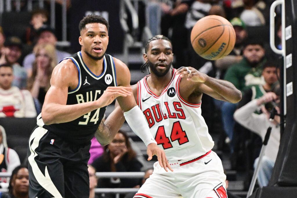 Nov 7, 2025; Milwaukee, Wisconsin, USA; Milwaukee Bucks forward Giannis Antetokounmpo (34) passes the ball away from Chicago Bulls forward Patrick Williams (44) in the second quarter at Fiserv Forum. Mandatory Credit: Benny Sieu-Imagn Images