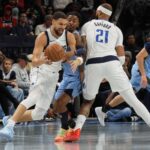 Nov 7, 2025; Memphis, Tennessee, USA; Dallas Mavericks guard Klay Thompson (31) dribbles the ball near a screen set by forward Daniel Gafford (21) against Memphis Grizzlies guard Ja Morant (12) during the second quarter at FedExForum. Mandatory Credit: Petre Thomas-Imagn Images
