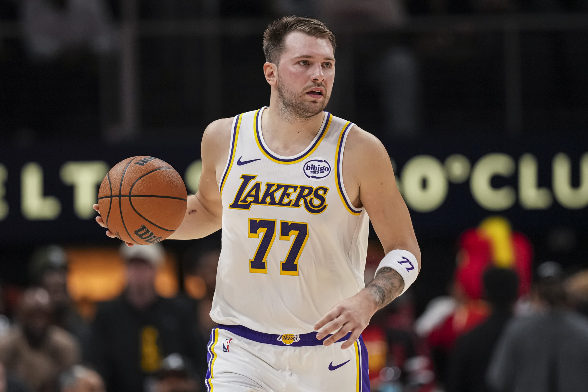 Nov 8, 2025; Atlanta, Georgia, USA; Los Angeles Lakers guard Luka Doncic (77) controls the ball against the Atlanta Hawks during the first half at State Farm Arena. Mandatory Credit: Dale Zanine-Imagn Images