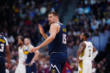 Nov 8, 2025; Denver, Colorado, USA; Denver Nuggets center Nikola Jokic (15) calls out in the second quarter against the Indiana Pacers at Ball Arena. Mandatory Credit: Ron Chenoy-Imagn Images