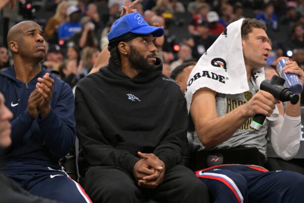 Nov 8, 2025; Inglewood, California, USA; Los Angeles Clippers guard Chris Paul (3), forward Kawhi Leonard (2) and center Brook Lopez (11) on the bench during the first half against the Phoenix Suns at Intuit Dome. Mandatory Credit: Jayne Kamin-Oncea-Imagn Images