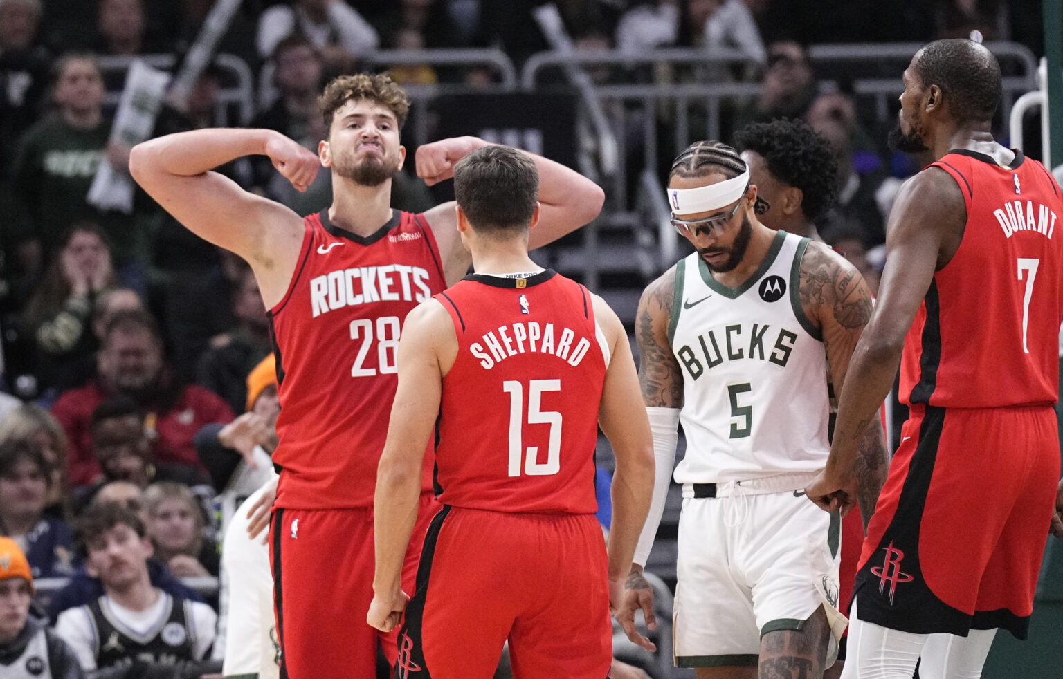 Nov 9, 2025; Milwaukee, Wisconsin, USA; Houston Rockets center Alperen Sengun (28) flexes after making a basket in the final minute of the game at Fiserv Forum. Mandatory Credit: Michael McLoone-Imagn Images