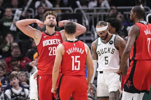 Nov 9, 2025; Milwaukee, Wisconsin, USA; Houston Rockets center Alperen Sengun (28) flexes after making a basket in the final minute of the game at Fiserv Forum. Mandatory Credit: Michael McLoone-Imagn Images
