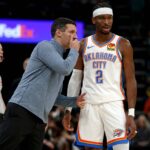 Nov 9, 2025; Memphis, Tennessee, USA; Oklahoma City Thunder head coach Mark Daigneault talks with guard Shai Gilgeous-Alexander (2) during the third quarter against the Memphis Grizzlies at FedExForum. Mandatory Credit: Petre Thomas-Imagn Images