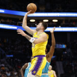 Nov 10, 2025; Charlotte, North Carolina, USA; Los Angeles Lakers forward/guard Luka Doncic (77) floats a shot towards the basket during the first quarter against the Charlotte Hornets at Spectrum Center. Mandatory Credit: Brian Westerholt-Imagn Images