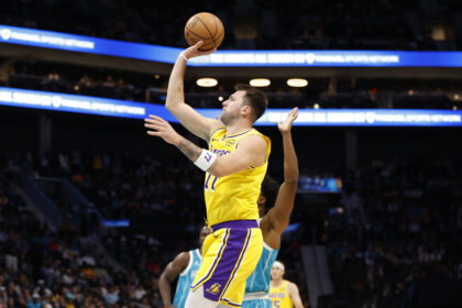 Nov 10, 2025; Charlotte, North Carolina, USA; Los Angeles Lakers forward/guard Luka Doncic (77) floats a shot towards the basket during the first quarter against the Charlotte Hornets at Spectrum Center. Mandatory Credit: Brian Westerholt-Imagn Images