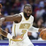 Nov 11, 2025; Philadelphia, Pennsylvania, USA; Boston Celtics guard Jaylen Brown (7) drives past Philadelphia 76ers guard Kelly Oubre Jr. (9) during the first quarter at Xfinity Mobile Arena. Mandatory Credit: Bill Streicher-Imagn Images