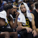 Nov 11, 2025; Oklahoma City, Oklahoma, USA; Golden State Warriors guard Buddy Hield (7) and guard Stephen Curry (30) talk on the bench during the second half against the Oklahoma City Thunder at Paycom Center. Mandatory Credit: Alonzo Adams-Imagn Images