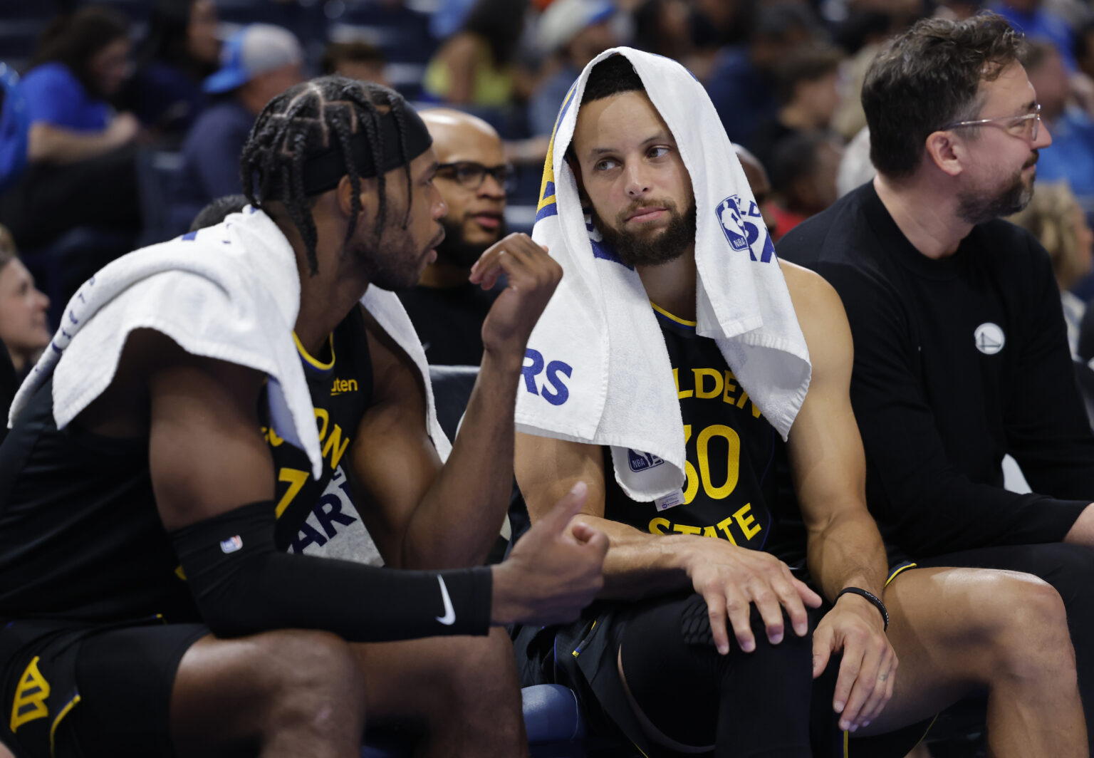Nov 11, 2025; Oklahoma City, Oklahoma, USA; Golden State Warriors guard Buddy Hield (7) and guard Stephen Curry (30) talk on the bench during the second half against the Oklahoma City Thunder at Paycom Center. Mandatory Credit: Alonzo Adams-Imagn Images