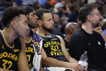 Nov 11, 2025; Oklahoma City, Oklahoma, USA; Golden State Warriors guard Stephen Curry (30) watches his team play against the Oklahoma City Thunder during the fourth quarter at Paycom Center. Mandatory Credit: Alonzo Adams-Imagn Images