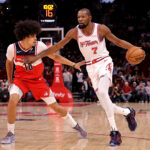 Nov 12, 2025; Houston, Texas, USA; Houston Rockets forward Kevin Durant (7) handles the ball against Washington Wizards forward Kyshawn George (18) during the first quarter at Toyota Center. Mandatory Credit: Erik Williams-Imagn Images