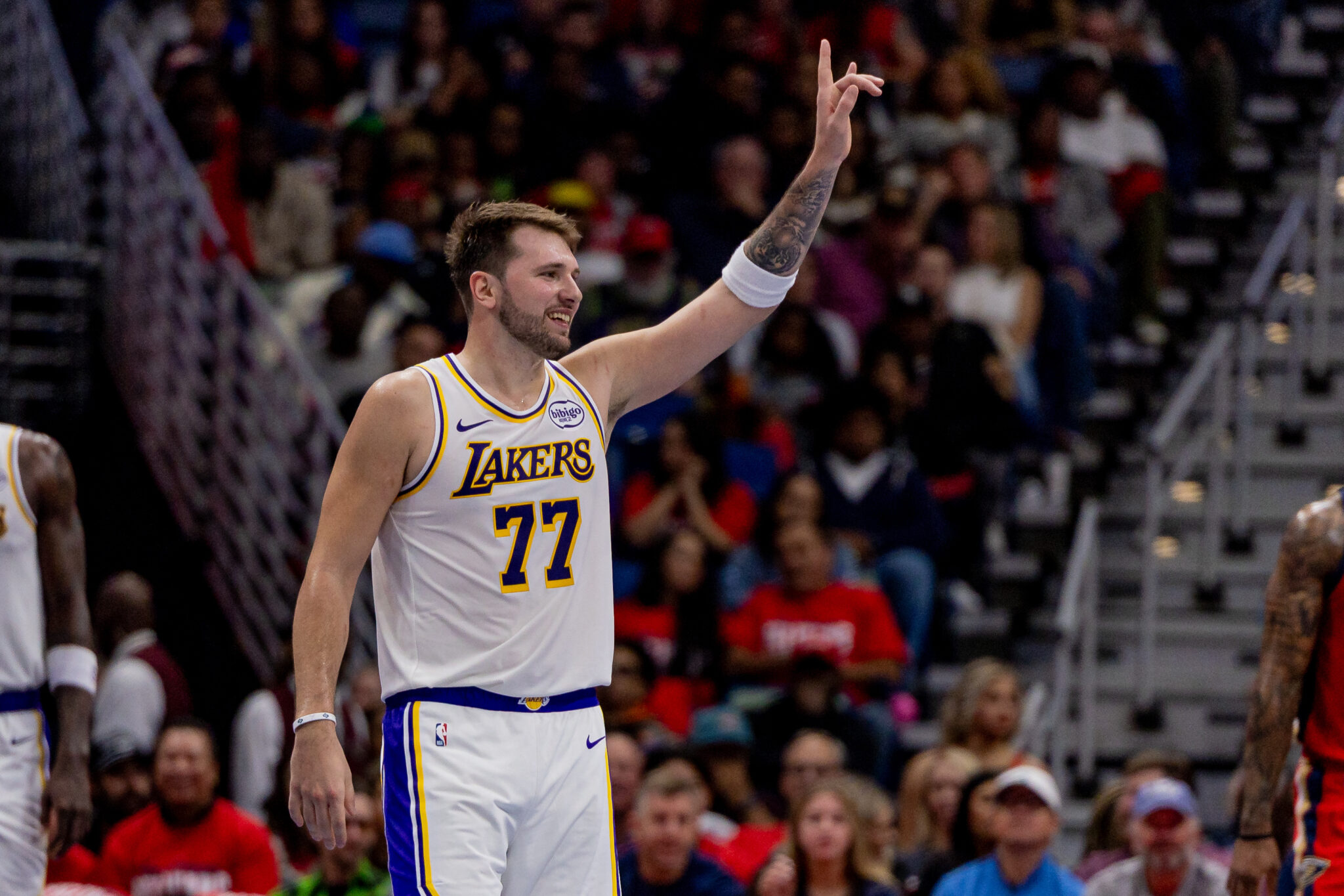 Nov 14, 2025; New Orleans, Louisiana, USA; Los Angeles Lakers forward/guard Luka Dončić (77) reacts to a play against the New Orleans Pelicans during the first half at Smoothie King Center. Mandatory Credit: Stephen Lew-Imagn Images