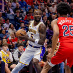 Nov 14, 2025; New Orleans, Louisiana, USA; Los Angeles Lakers center Deandre Ayton (5) dribbles against New Orleans Pelicans forward Trey Murphy III (25) during the first half at Smoothie King Center. Mandatory Credit: Stephen Lew-Imagn Images