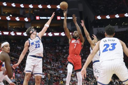 Nov 16, 2025; Houston, Texas, USA; Houston Rockets forward Kevin Durant (7) shoots the ball as Orlando Magic forward Franz Wagner (22) defends during the second quarter at Toyota Center. Mandatory Credit: Troy Taormina-Imagn Images