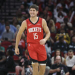 Nov 16, 2025; Houston, Texas, USA; Houston Rockets guard Reed Sheppard (15) smiles after a play during the second quarter against the Orlando Magic at Toyota Center. Mandatory Credit: Troy Taormina-Imagn Images