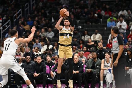 Nov 16, 2025; Washington, District of Columbia, USA; Washington Wizards forward Corey Kispert (24) attempts a jump shot in front of Brooklyn Nets forward Michael Porter Jr. (17) during the third quarter at Capital One Arena. Mandatory Credit: Rafael Suanes-Imagn Images
