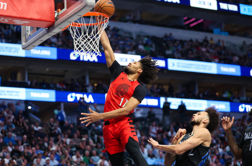 Nov 16, 2025; Dallas, Texas, USA; Portland Trail Blazers guard Shaedon Sharpe (17) shoots past Dallas Mavericks center Dereck Lively II (2) during the second half at American Airlines Center. Mandatory Credit: Kevin Jairaj-Imagn Images