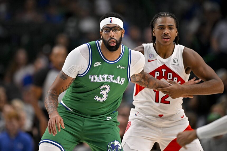 Oct 26, 2025; Dallas, Texas, USA; Dallas Mavericks forward Anthony Davis (3) and Toronto Raptors forward Collin Murray-Boyles (12) look for the ball during the game between the Mavericks and the Raptors at the American Airlines Center. Mandatory Credit: Jerome Miron-Imagn Images