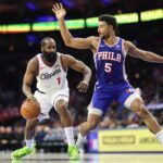Nov 17, 2025; Philadelphia, Pennsylvania, USA; LA Clippers guard James Harden (1) drives against Philadelphia 76ers guard Quentin Grimes (5) during the third quarter at Xfinity Mobile Arena. Mandatory Credit: Bill Streicher-Imagn Images