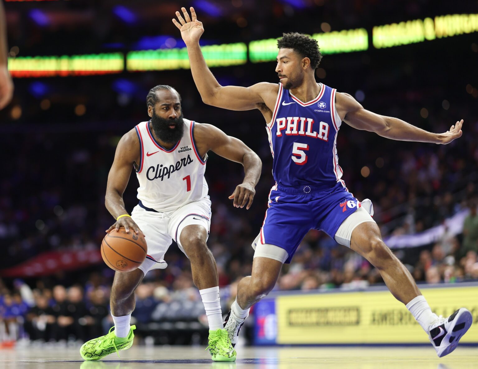 Nov 17, 2025; Philadelphia, Pennsylvania, USA; LA Clippers guard James Harden (1) drives against Philadelphia 76ers guard Quentin Grimes (5) during the third quarter at Xfinity Mobile Arena. Mandatory Credit: Bill Streicher-Imagn Images