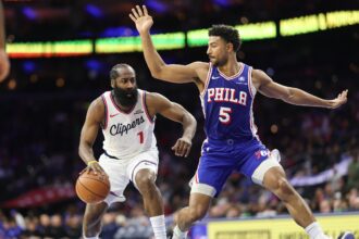 Nov 17, 2025; Philadelphia, Pennsylvania, USA; LA Clippers guard James Harden (1) drives against Philadelphia 76ers guard Quentin Grimes (5) during the third quarter at Xfinity Mobile Arena. Mandatory Credit: Bill Streicher-Imagn Images