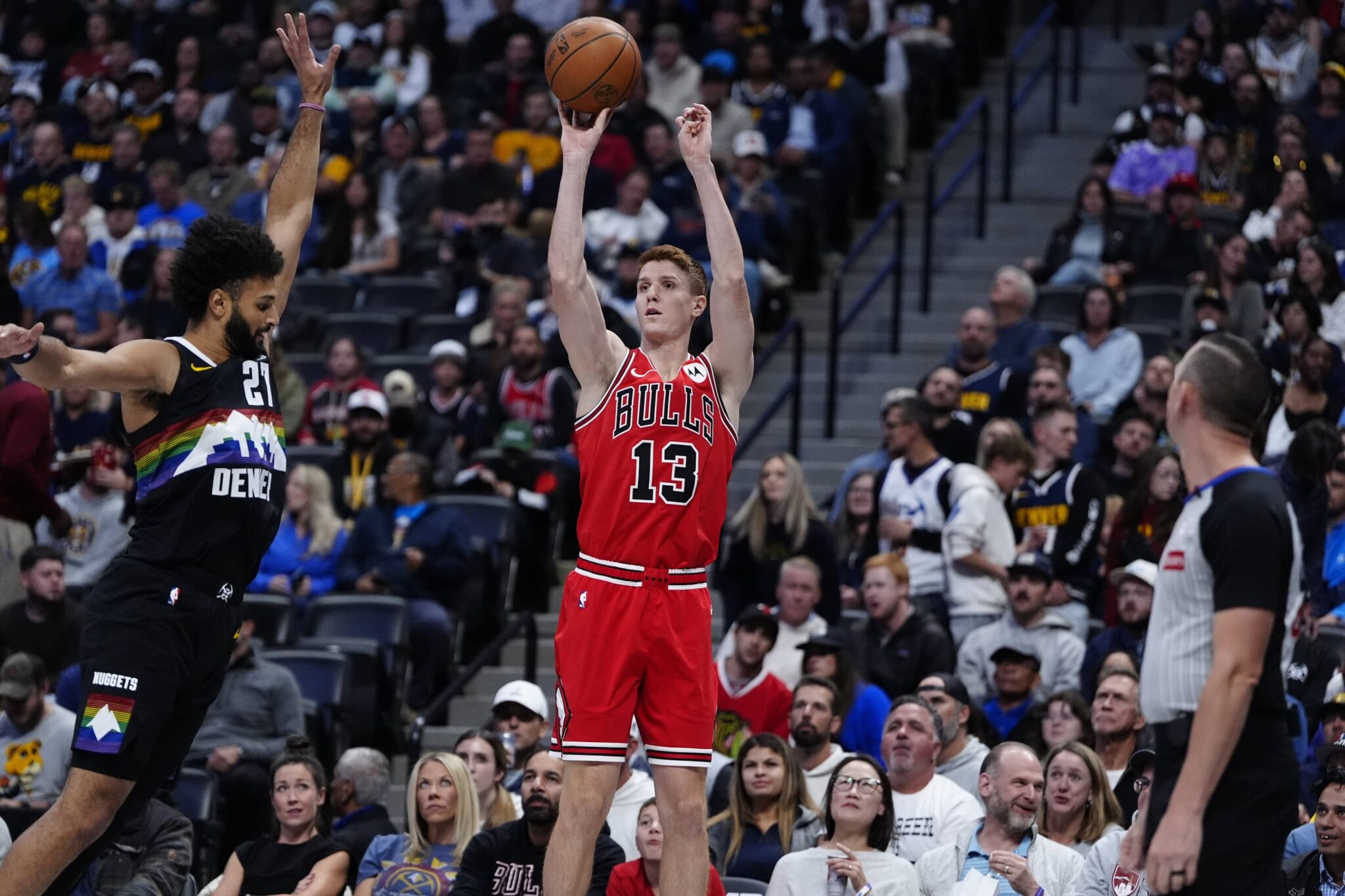 Nov 17, 2025; Denver, Colorado, USA; Chicago Bulls guard/forward Kevin Huerter (13) shoots the ball over Denver Nuggets guard Jamal Murray (27) in the first quarter at Ball Arena. Mandatory Credit: Ron Chenoy-Imagn Images