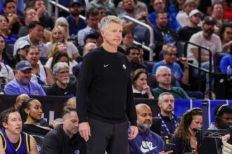 Nov 18, 2025; Orlando, Florida, USA; Golden State Warriors head coach Steve Kerr reacts during the second half against the Orlando Magic at Kia Center. Mandatory Credit: Mike Watters-Imagn Images