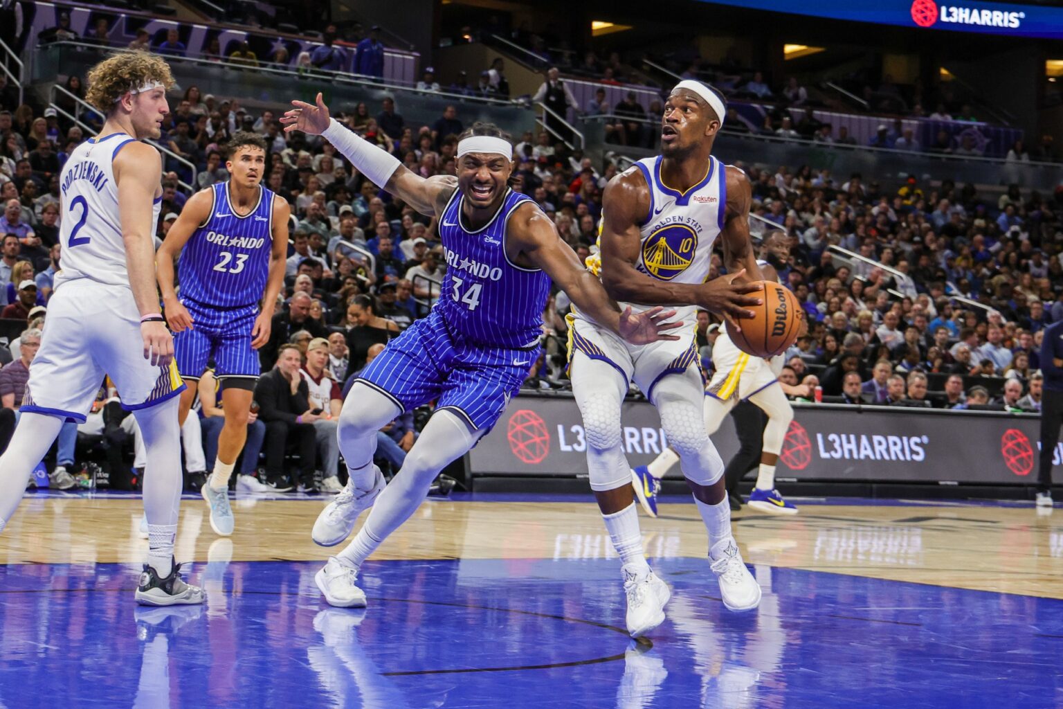 Nov 18, 2025; Orlando, Florida, USA; Golden State Warriors forward Jimmy Butler III (10) looks to shoot against Orlando Magic center Wendell Carter Jr. (34) during the second half at Kia Center. Mandatory Credit: Mike Watters-Imagn Images