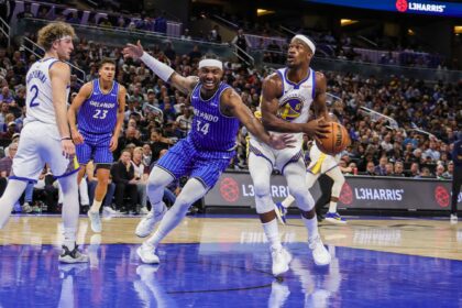 Nov 18, 2025; Orlando, Florida, USA; Golden State Warriors forward Jimmy Butler III (10) looks to shoot against Orlando Magic center Wendell Carter Jr. (34) during the second half at Kia Center. Mandatory Credit: Mike Watters-Imagn Images