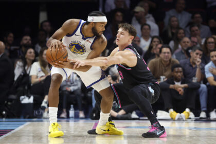 Nov 19, 2025; Miami, Florida, USA; Miami Heat guard Pelle Larsson (9) defends against Golden State Warriors guard Moses Moody (4) during the second half at Kaseya Center. Mandatory Credit: Rhona Wise-Imagn Images