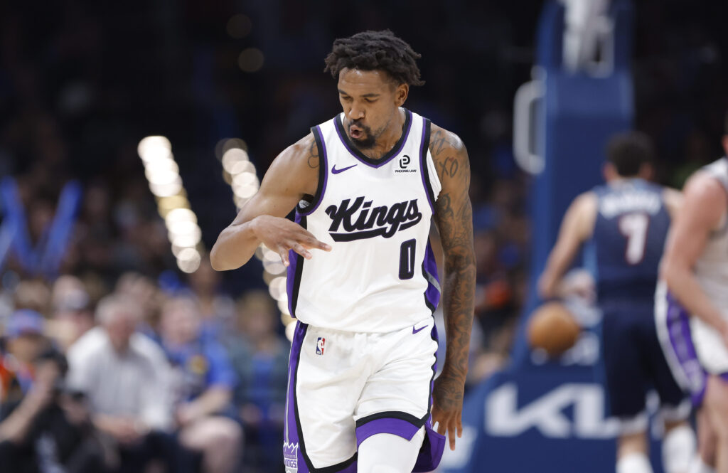Nov 19, 2025; Oklahoma City, Oklahoma, USA; Sacramento Kings guard Malik Monk (0) gestures after scoring against the Oklahoma City Thunder during the second half at Paycom Center. Mandatory Credit: Alonzo Adams-Imagn Images