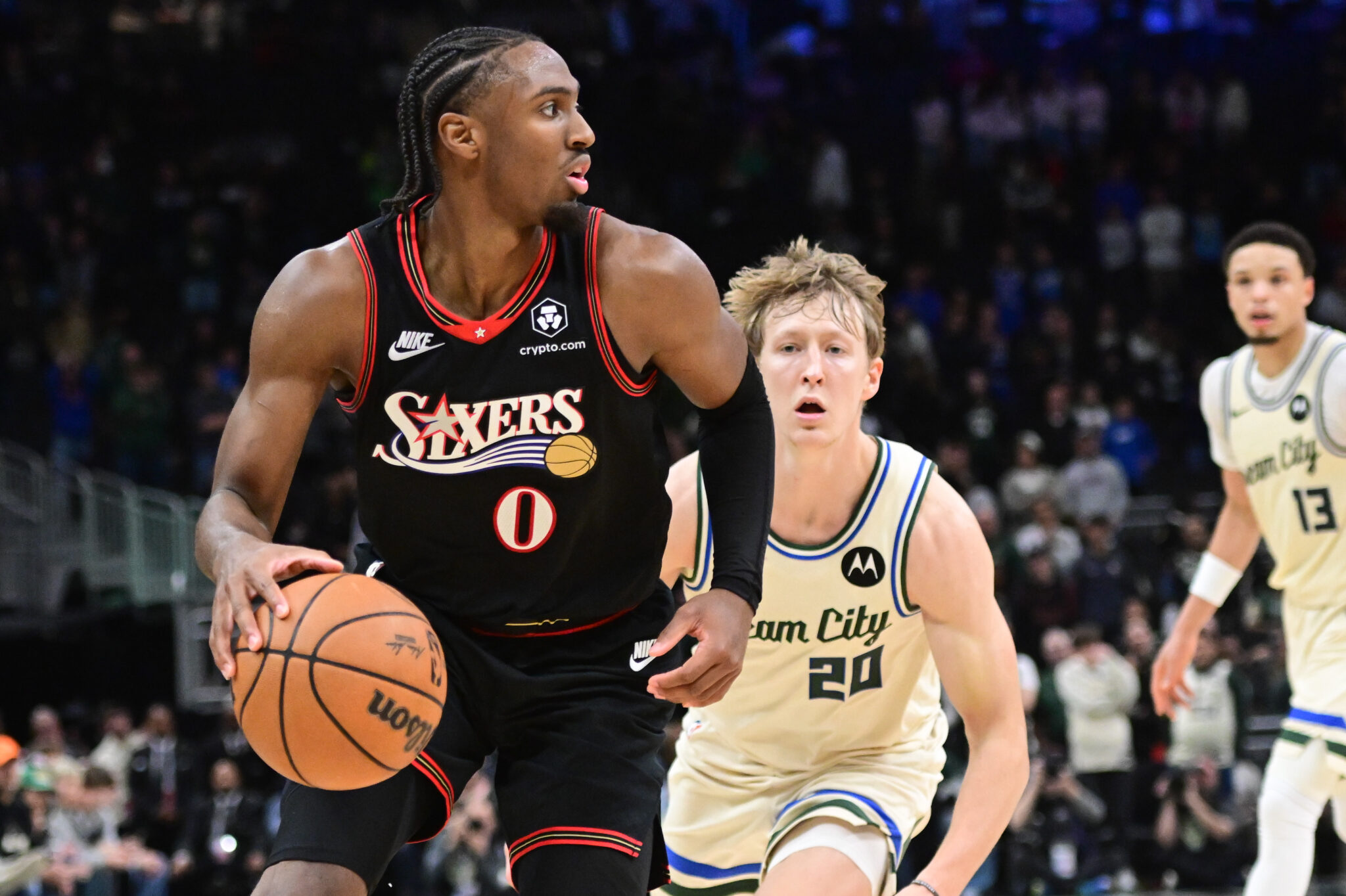 Nov 20, 2025; Milwaukee, Wisconsin, USA; Philadelphia 76ers guard Tyrese Maxey (0) looks for a shot against Milwaukee Bucks guard AJ Green (20) in the first overtime at Fiserv Forum. Mandatory Credit: Benny Sieu-Imagn Images
