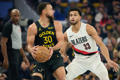 Nov 21, 2025; San Francisco, California, USA; Portland Trail Blazers forward Toumani Camara (33) defends against Golden State Warriors guard Stephen Curry (30) during the first quarter at Chase Center. Mandatory Credit: Robert Edwards-Imagn Images
