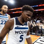 Nov 21, 2025; Phoenix, Arizona, USA; Minnesota Timberwolves guard Anthony Edwards (5) and center Rudy Gobert (27) react as they walk off the court after losing to the Phoenix Suns in the second half of an NBA Cup game at Mortgage Matchup Center. Mandatory Credit: Mark J. Rebilas-Imagn Images