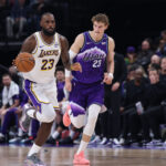 Nov 23, 2025; Salt Lake City, Utah, USA; Los Angeles Lakers forward LeBron James (23) brings the ball up the court against Utah Jazz forward Lauri Markkanen (23) during the second quarter at Delta Center. Mandatory Credit: Rob Gray-Imagn Images