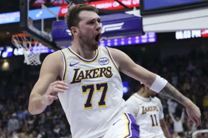Nov 23, 2025; Salt Lake City, Utah, USA; Los Angeles Lakers guard Luka Doncic (77) reacts to a play against the Utah Jazz during the second quarter at Delta Center. Mandatory Credit: Rob Gray-Imagn Images