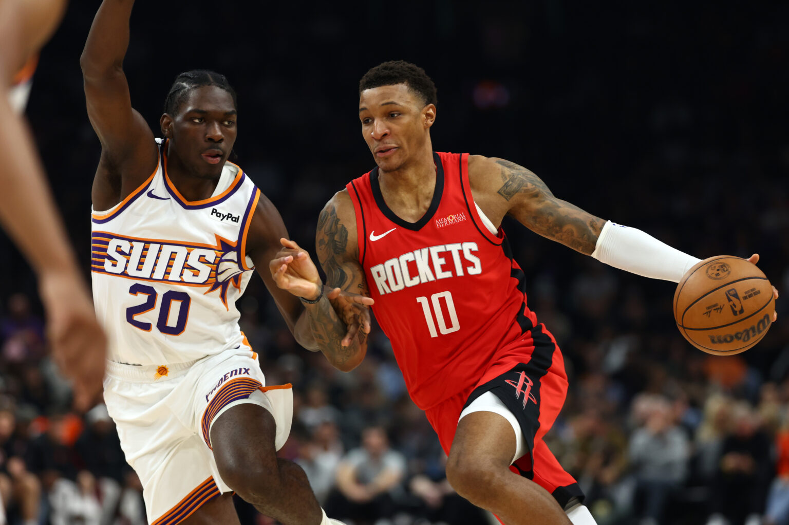 Nov 24, 2025; Phoenix, Arizona, USA; Phoenix Suns forward Rasheer Fleming (20) defends against Houston Rockets forward Jabari Smith Jr. (10) in the first half at Mortgage Matchup Center. Mandatory Credit: Mark J. Rebilas-Imagn Images