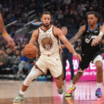 Nov 24, 2025; San Francisco, California, USA; Golden State Warriors guard Stephen Curry (30) dribbles the ball next to Utah Jazz guard Keyonte George (3) in the second quarter at the Chase Center. Mandatory Credit: Cary Edmondson-Imagn Images