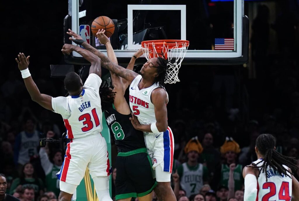 Nov 26, 2025; Boston, Massachusetts, USA; Detroit Pistons forward Ronald Holland II (5) and guard Javonte Green (31) defend against Boston Celtics forward Josh Minott (8) in the first half at TD Garden. Mandatory Credit: David Butler II-Imagn Images