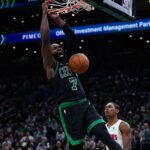 Nov 26, 2025; Boston, Massachusetts, USA; Boston Celtics guard Jaylen Brown (7) makes the basket against the Detroit Pistons in the second half at TD Garden. Mandatory Credit: David Butler II-Imagn Images