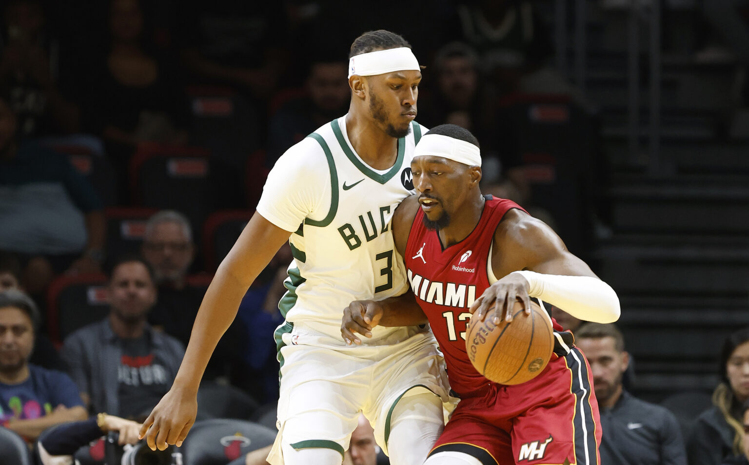 Nov 26, 2025; Miami, Florida, USA; Milwaukee Bucks center Myles Turner (3) defends Miami Heat center Bam Adebayo (13) during the first half of an NBA Cup game at Kaseya Center. Mandatory Credit: Rhona Wise-Imagn Images