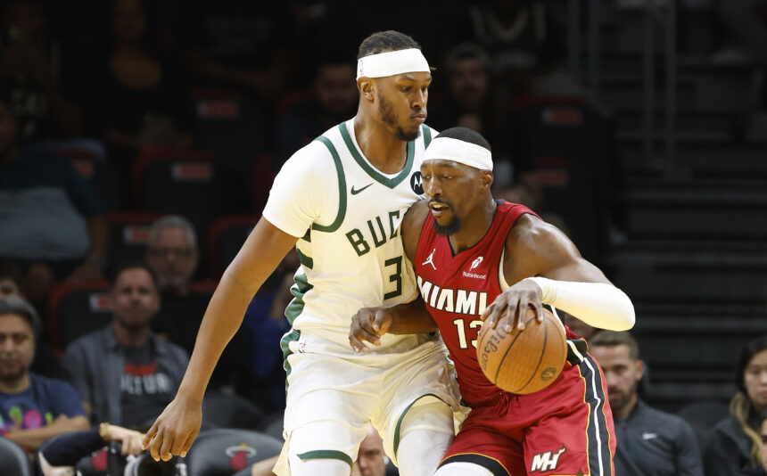 Nov 26, 2025; Miami, Florida, USA; Milwaukee Bucks center Myles Turner (3) defends Miami Heat center Bam Adebayo (13) during the first half of an NBA Cup game at Kaseya Center. Mandatory Credit: Rhona Wise-Imagn Images