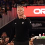 Nov 26, 2025; San Francisco, California, USA; Golden State Warriors head coach Steve Kerr watches the scoreboard against the Houston Rockets in the second quarter at Chase Center. Mandatory Credit: David Gonzales-Imagn Images