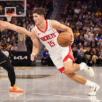 Nov 26, 2025; San Francisco, California, USA; Houston Rockets guard Reed Sheppard (15) drives to the basket against Golden State Warriors guard Brandin Podziemski (2) in the third quarter at Chase Center. Mandatory Credit: David Gonzales-Imagn Images