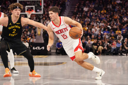 Nov 26, 2025; San Francisco, California, USA; Houston Rockets guard Reed Sheppard (15) drives to the basket against Golden State Warriors guard Brandin Podziemski (2) in the third quarter at Chase Center. Mandatory Credit: David Gonzales-Imagn Images