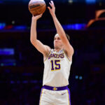 Nov 30, 2025; Los Angeles, California, USA; Los Angeles Lakers guard Austin Reaves (15) shoots against the New Orleans Pelicans during the first half at Crypto.com Arena. Mandatory Credit: Gary A. Vasquez-Imagn Images