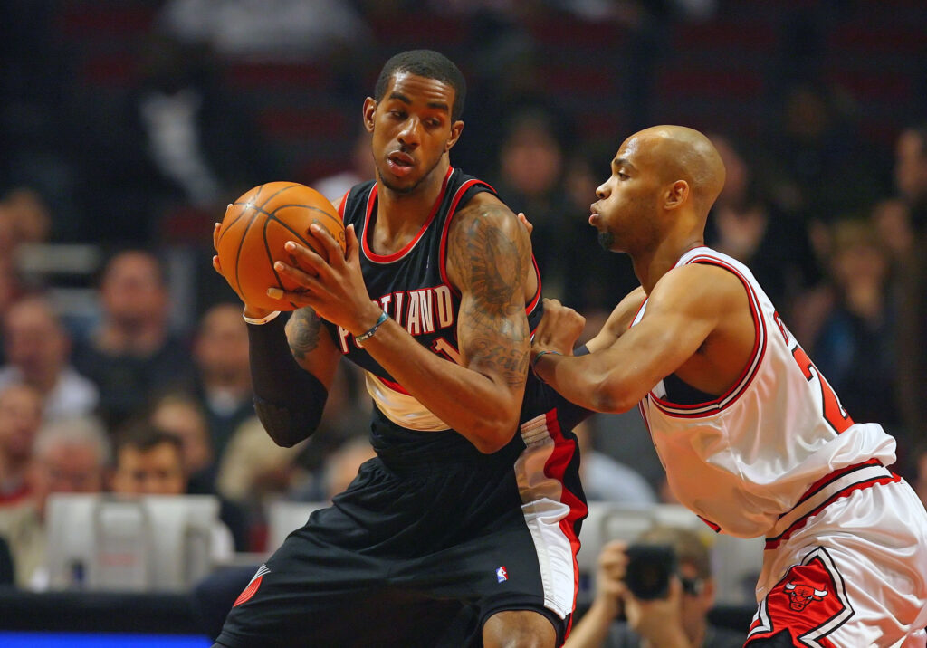 Feb 26, 2010; Chicago, IL, USA; Portland Trailblazers forward LaMarcus Aldridge (12) being defended by Chicago Bulls forward Taj Gibson (22) during the first half at the United Center. Mandatory Credit: Dennis Wierzbicki-Imagn Images